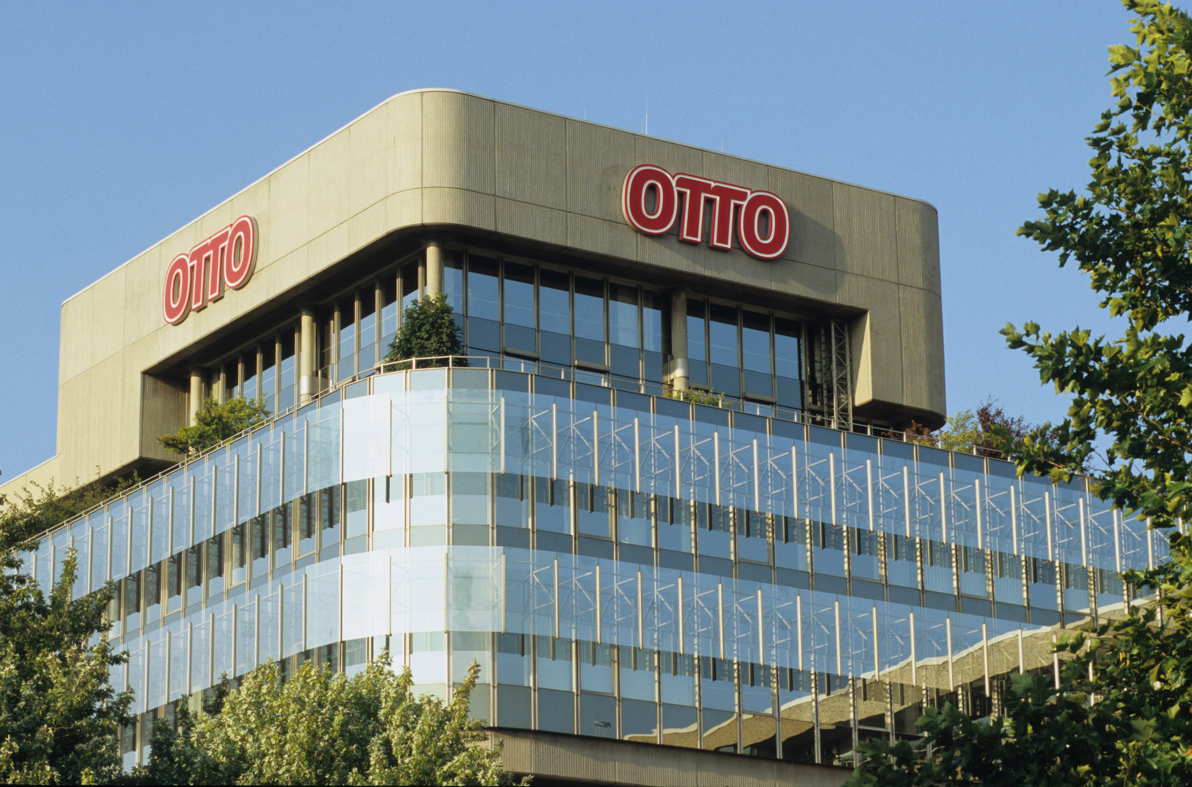 OTTO headquarters building with the red OTTO logo against a blue sky